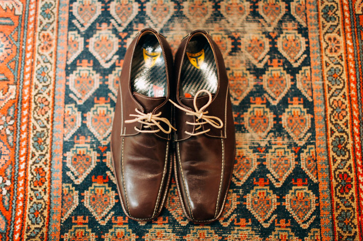 groom's shoes on patterned carpet