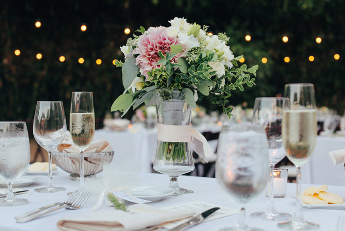 table setting with pink and peach flowers