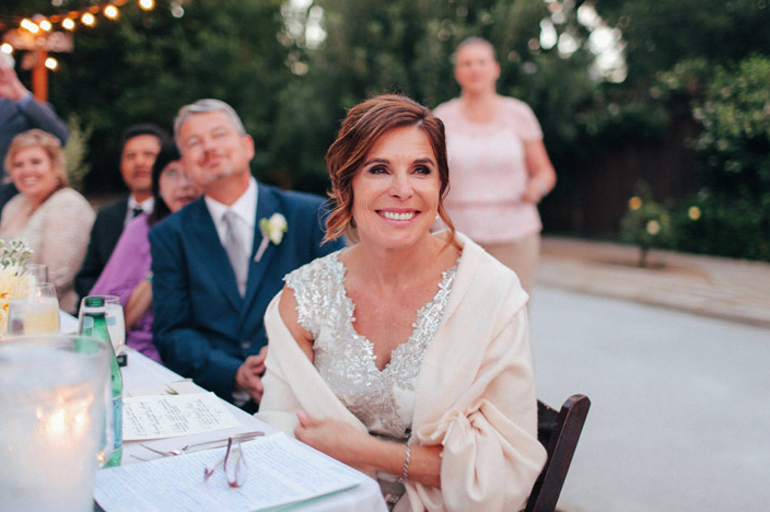 mother of bride smiling during toasts