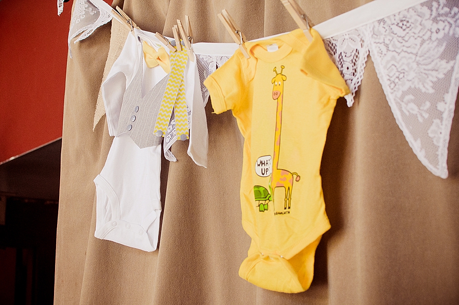 onsies hung on a lace and burlap bunting